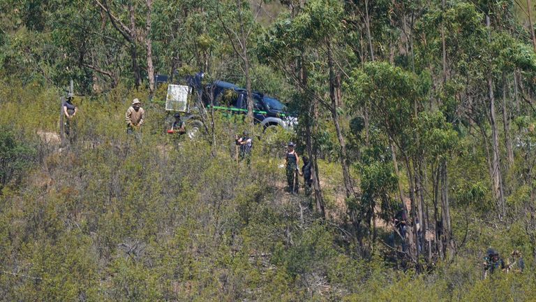 Personnel at Barragem do Arade reservoir, in the Algave, Portugal, as searches continue as part of the investigation into the disappearance of Madeleine McCann. The area is around 50km from Praia da Luz where Madeleine went missing in 2007. Picture date: Thursday May 25, 2023. PA Photo. See PA story POLICE Portugal. Photo credit should read: Yui Mok/PA Wire