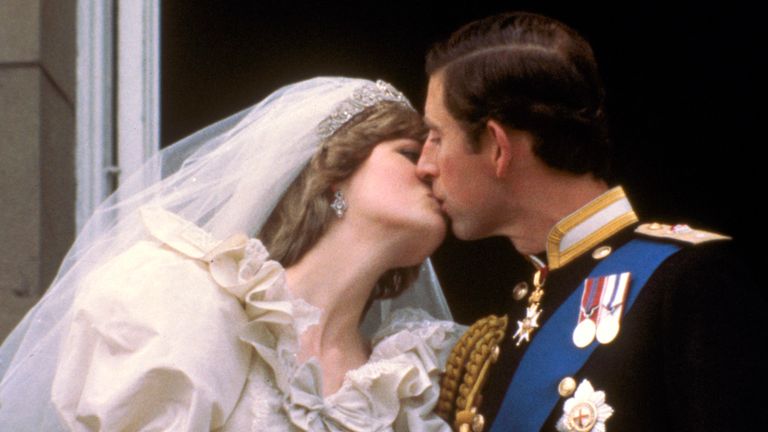 Prince Charles kisses Princess Diana, on the balcony of Buckingham Palace in London after their wedding. Pic: AP
