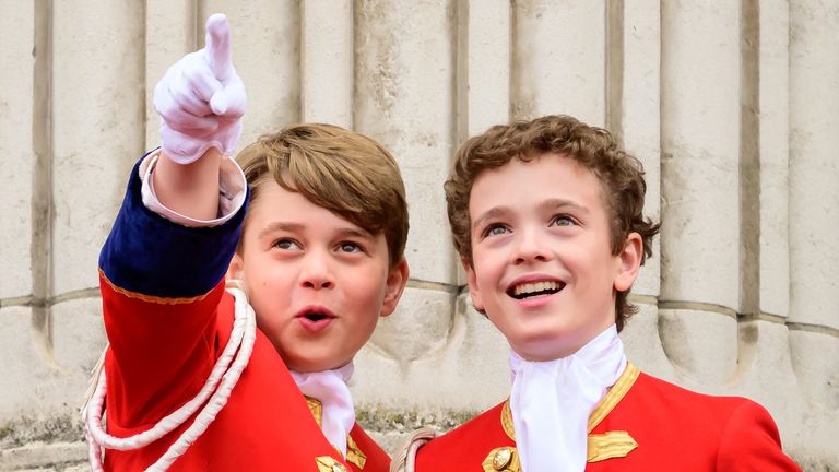 LONDON, ENGLAND - MAY 06: Prince George (L) points while on the balcony of Buckingham Palace during the Coronation of King Charles III and Queen Camilla on May 06, 2023 in London, England. The Coronation of Charles III and his wife, Camilla, as King and Queen of the United Kingdom of Great Britain and Northern Ireland, and the other Commonwealth realms takes place at Westminster Abbey today. Charles acceded to the throne on 8 September 2022, upon the death of his mother, Elizabeth II. Leon Neal/