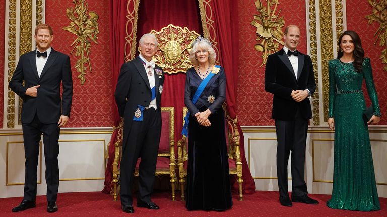 (L-R) Prince Harry, King Charles, Queen Camilla, and the Prince and Princess of Wales in the throne room at Madame Tussauds