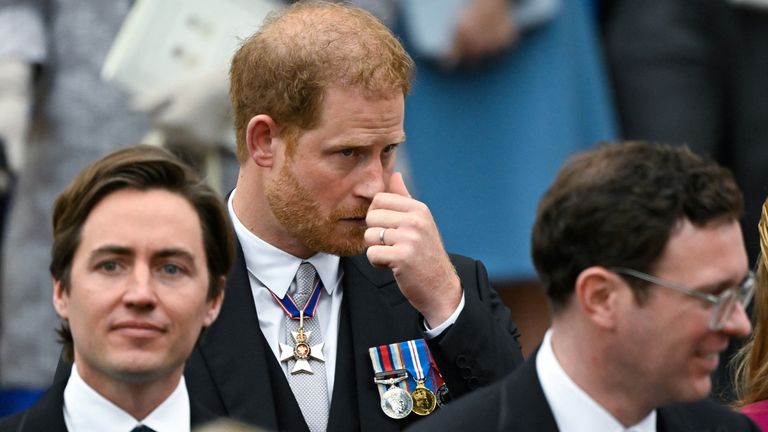 Prince Harry departs Westminster Abbey following the coronation 