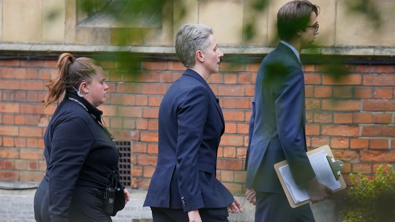 Professor Kathleen Stock (centre) arriving at the Oxford Union