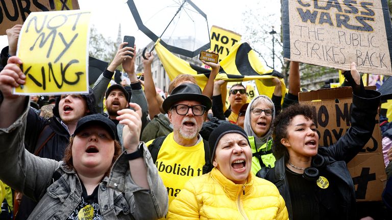 Protesters hold placards as people gather on the day of Britain&#39;s King Charles and Queen Camilla&#39;s coronation ceremony, in London, Britain May 6, 2023. REUTERS/Piroschka van de Wouw/Pool
