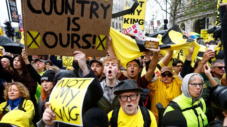 Protesters hold placards as people gather on the day of Britain&#39;s King Charles and Queen Camilla&#39;s coronation ceremony, in London, Britain May 6, 2023. REUTERS/Piroschka van de Wouw/Pool
