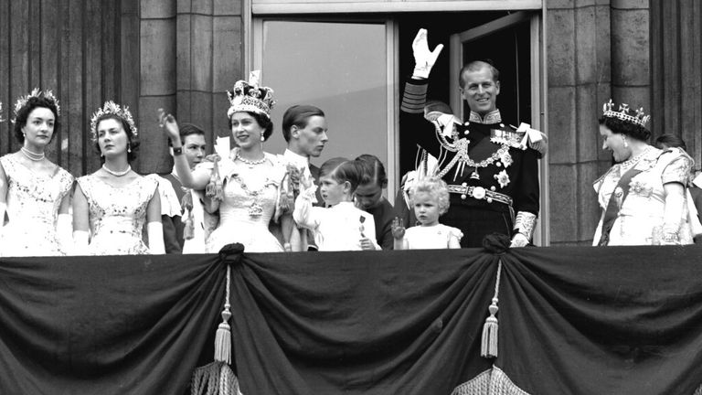 Britain&#39;s Queen Elizabeth II waves from the balcony of Buckingham Palace following her Coronation at Westminster Abbey in 1953