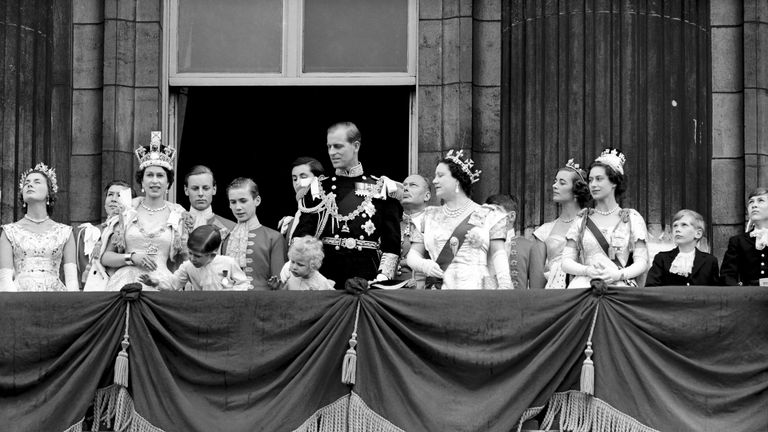 Queen Elizabeth II and Prince Philip stand on Buckingham Palace balcony