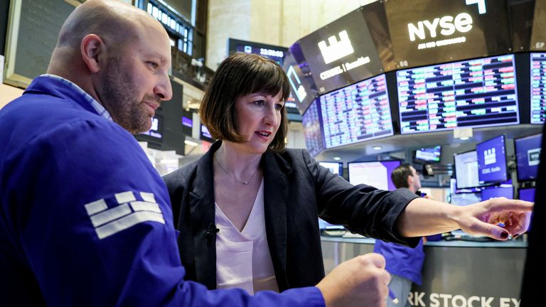 Rachel Reeves, Shadow Chancellor of the Exchequer, speaks with specialist trader John Parisi during a visit to the floor of the New York Stock Exchange (NYSE) in New York City, U.S., May 22, 2023. REUTERS/Brendan McDermid
