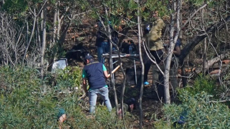 Personnel at Barragem do Arade reservoir, in the Algave, Portugal, as searches continue as part of the investigation into the disappearance of Madeleine McCann. The area is around 50km from Praia da Luz where Madeleine went missing in 2007. Picture date: Thursday May 25, 2023.