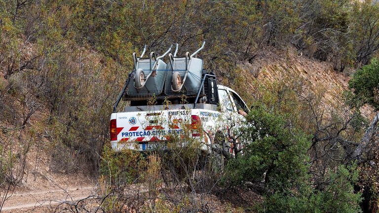 A vehicle of Portugal&#39;s Emergency Services carries wheelbarrows at the site of a remote reservoir where a new search for the body of Madeleine McCann is set to take place, in Silves, Portugal, in this screen grab from a video, May 22, 2023. REUTERS/Luis Ferreira

