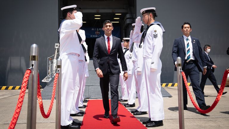 Prime Minister Rishi Sunak disembarks the Japanese aircraft carrier, JS Izumo where he inspected a guard of honour with vice defence minister, Toshiro Ino during a visit to the Japan Maritime Self-Defence Force (JMSF) at Yokosuka Naval Base, ahead of the G7 Summit in Hiroshima. Picture date: Thursday May 18, 2023.