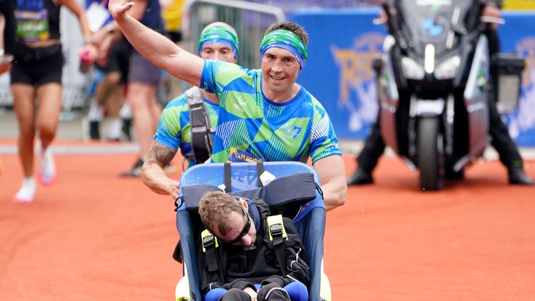 Rob Burrow and Kevin Sinfield cross the finish line of the 2023 Rob Burrow Leeds Marathon which started and finished at Headingley Stadium, Leeds. Picture date: Sunday May 14, 2023. PA Photo. See PA story ATHLETICS Leeds. Photo credit should read: Danny Lawson/PA Wire...RESTRICTIONS: Use subject to restrictions. Editorial use only, no commercial use without prior consent from rights holder.