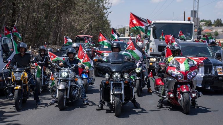 Bikers display Jordanian flags during a rally celebrating the upcoming royal wedding, in Amman, Jordan, Tuesday, May 30, 2023. Crown Prince Al Hussein and Saudi architect Rajwa Alseif are due to wed in a wedding on Thursday at the palace in Jordan, a western country.  allied monarchy that has been a bastion of stability for decades as unrest in the Middle East has descended on its borders.  (AP Photo/Nasser Nasser)