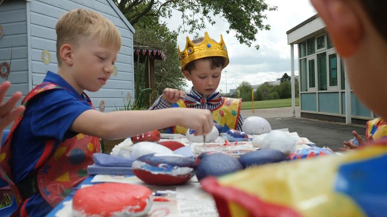 Children at a state school in Derby paint rocks in the colours of the Union Jack during class to learn about the Monarchy 