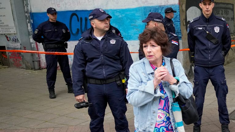 Police block streets around the Vladislav Ribnikar school where the shooting took place. Pic: AP