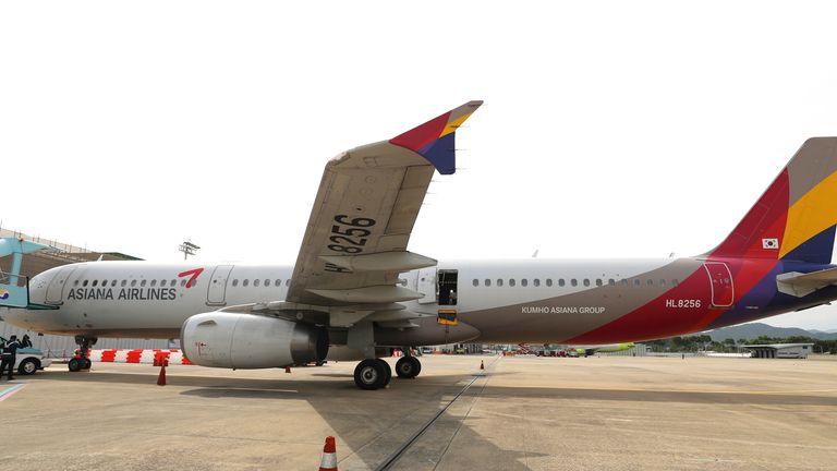 An Asiana Airlines plane is parked as one of the plane's doors suddenly opened at Daegu International Airport in Daegu, South Korea, Friday, May 26, 2023. Photo: AP