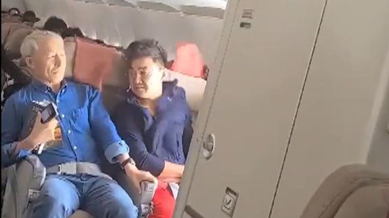 Footage shows mid-flight panic as passenger opens door
