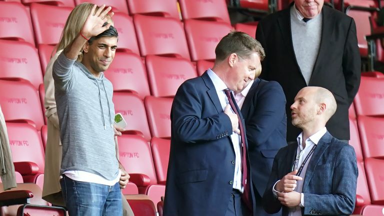 Prime minister Rishi Sunak (left) waving from the stands during the Premier League match at St. Mary&#39;s Stadium, Southampton. Picture date: Saturday May 13, 2023.

