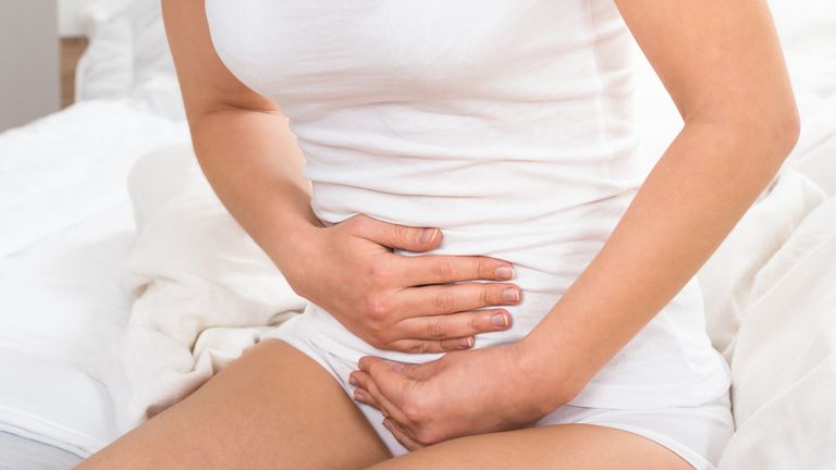 Close-up Of Woman Suffering From Stomach Ache. Menstruation, menopause. File Pic. 

