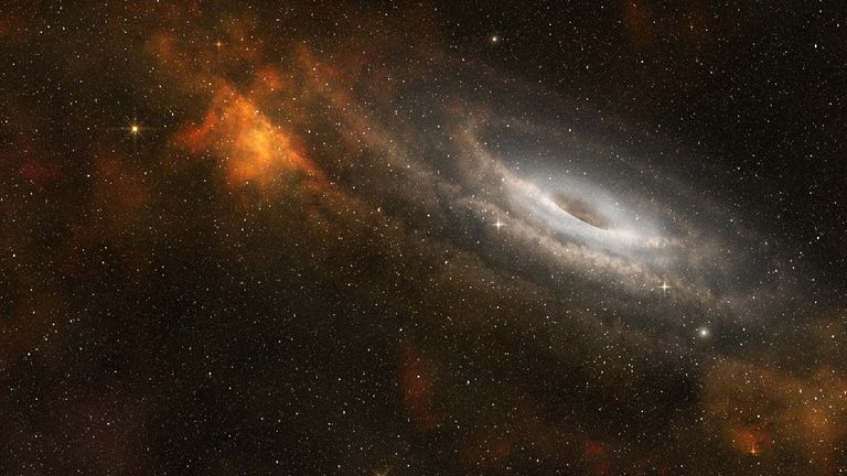 Black hole at the center of a spiral galaxy - iStock