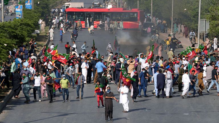 Supporters of Pakistan&#39;s former Prime Minister Imran Khan throw stones toward police 
Pic:AP