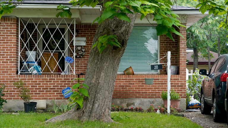 The front entrance of a home connected to suspected mall gunman, Mauricio Garcia, has been searched by police 