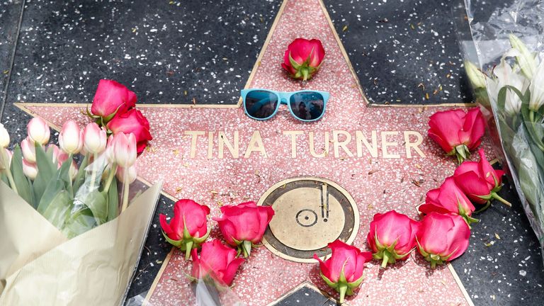 Flowers lie across US singer Tina Turner&#39;s Hollywood Walk of Fame Star in Los Angeles.