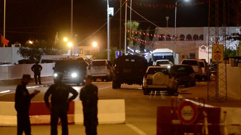 Members of the security forces stand near the entrance of Ghriba synagogue, following an attack, in Djerba, Tunisia May 9, 2023, in this screen grab from a video. REUTERS/Stringer NO RESALES. NO ARCHIVES