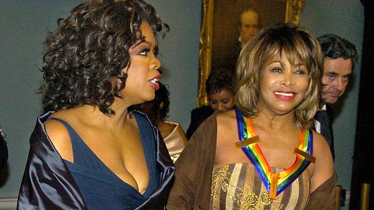 Talk show host Oprah Winfrey (L) and Kennedy Center 2005 Honoree Tina Turner walk together as they depart the gala dinner at the State Department in Washington December 3, 2005. The Kennedy Center award is given for a lifetime contribution to the arts and American culture. REUTERS/Mike Theiler