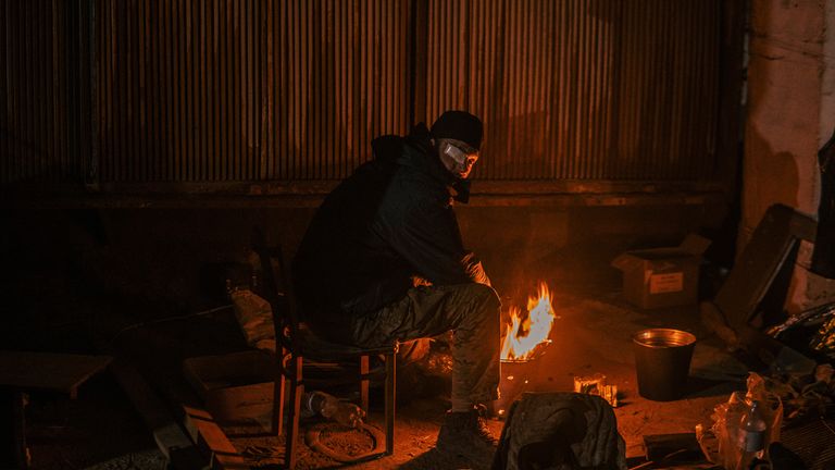 In this photo provided by the Azov Special Forces Regiment of the Ukrainian National Guard Press Bureau, a Ukrainian soldier inside the ruined Azovstal Steel Plant rests in his shelter in Mariupol, Ukraine , May 7, 2022. For nearly three months, the Azovstal garrison hung on, refusing to be driven out of the tunnels and bunkers beneath the labyrinthine mill ruins.  A Ukrainian soldier-photographer documented the events and broadcast them to the world.  Now he is a prisoner of the Russians.  Her 