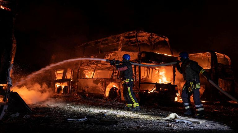 Firefighters work at a site of a vehicle parking area damaged by remains of Russian missiles, amid Russia’s attack on Ukraine, in Kyiv, Ukraine May 16, 2023. Pavlo Petrov/Press service of the State Emergency Service of Ukraine in Kyiv/Handout via REUTERS ATTENTION EDITORS - THIS IMAGE HAS BEEN SUPPLIED BY A THIRD PARTY.
