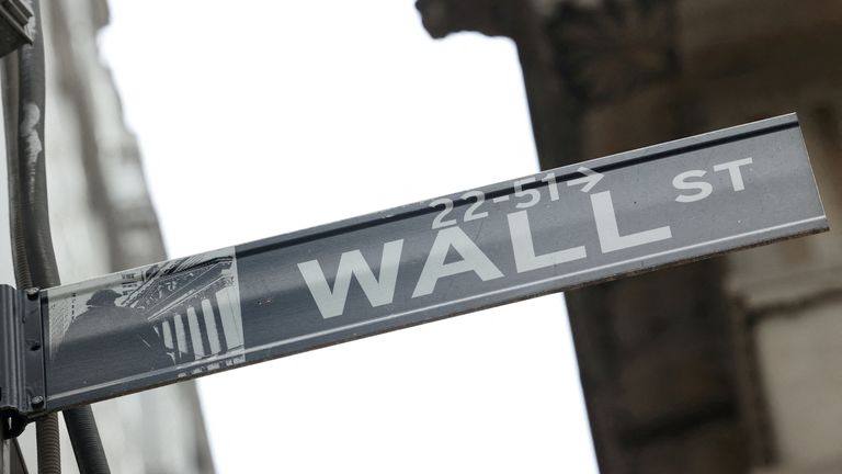 A street sign marks Wall Street outside the New York Stock Exchange  in New York City.