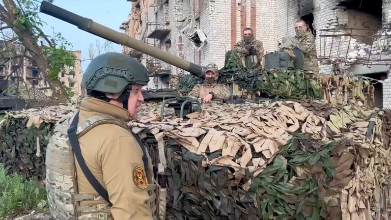 Founder of Wagner private mercenary group Yevgeny Prigozhin talks to Wagner fighters in the course of Russia-Ukraine conflict in Bakhmut, Ukraine, in this still image taken from video released May 25