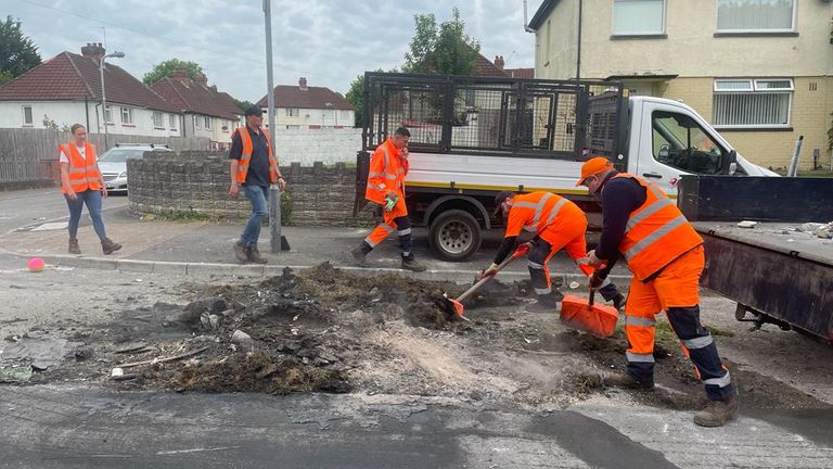 Council workers clear damage on Stanway Road in Ely, Cardiff, after violent scenes the previous evening. Pic date: 23 May 2023