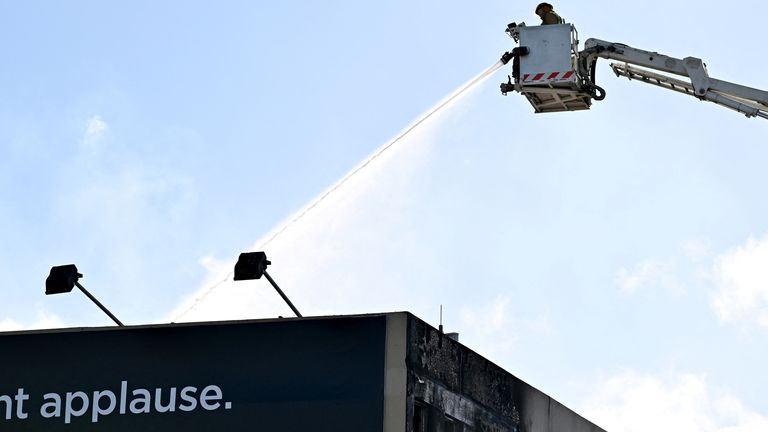 Firefighters work at the scene of a fatal hostel fire in Wellington, New Zealand May 16, 2023. Pic: AAP/Reuters