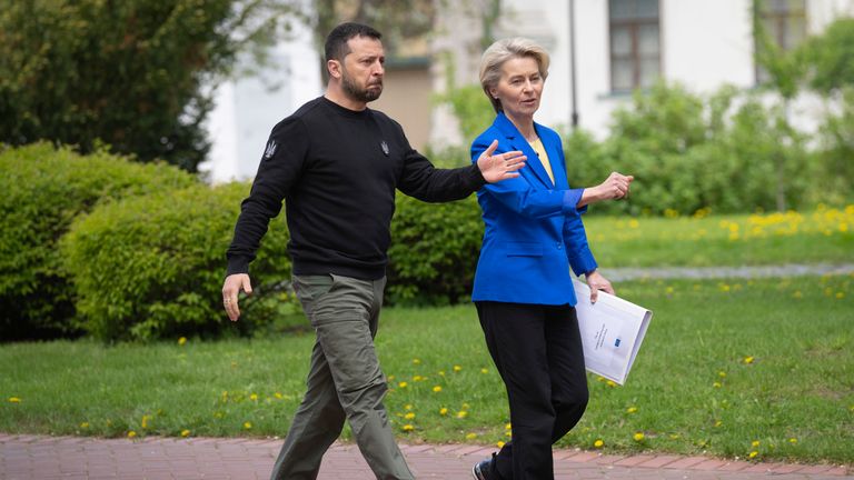 Volodymyr Zelenskyy and European Commission President Ursula von der Leyen approach media before their press conference in Kyiv