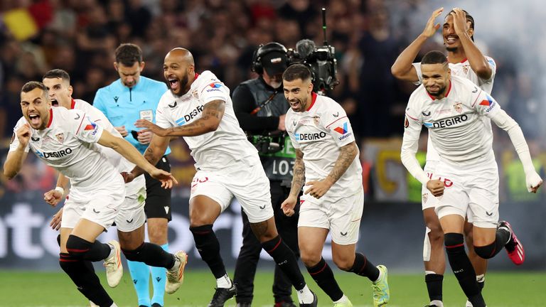 Sevilla players celebrate after winning the Europa League final on penalities
