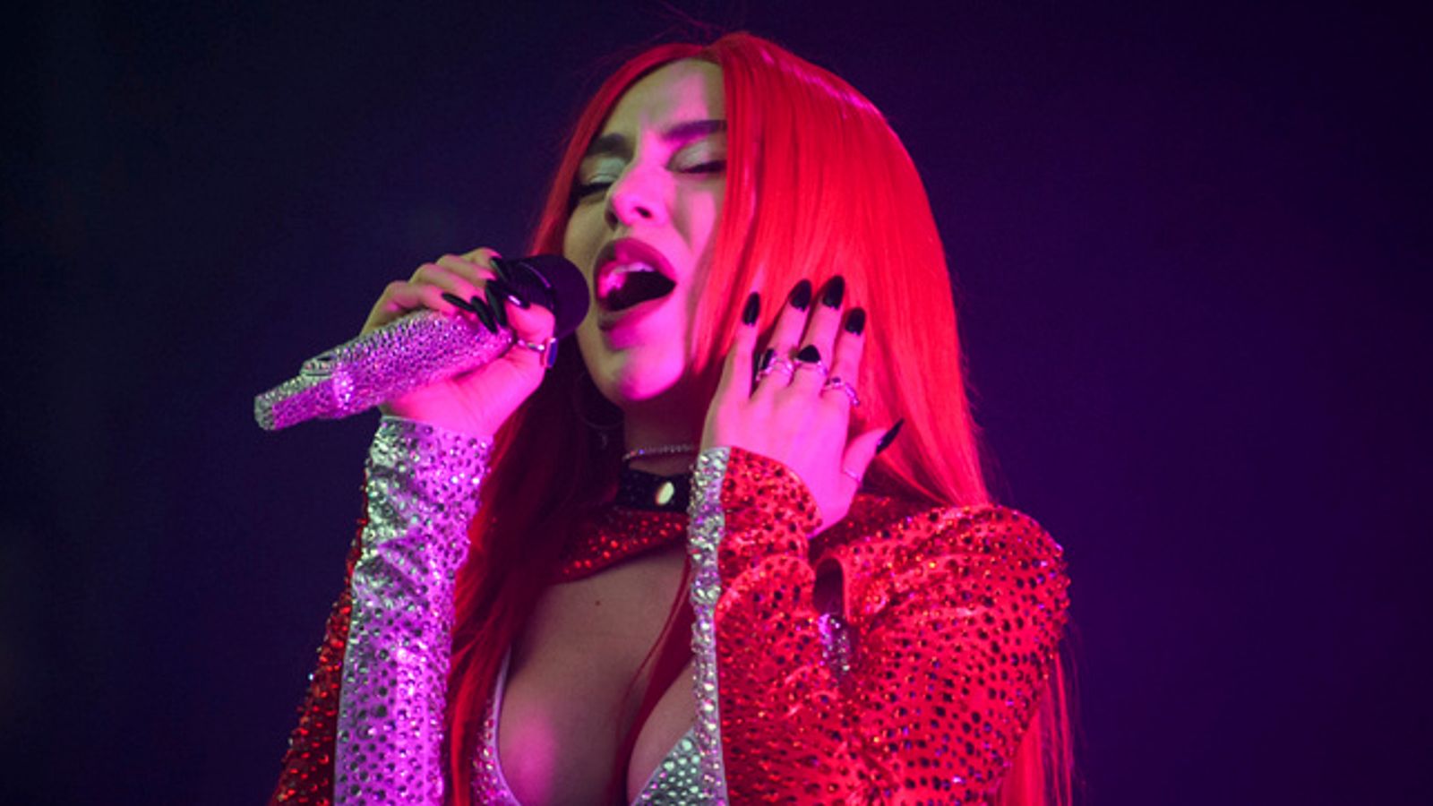 Ava Max slapped in face and scratched in the eye by man who runs on stage during her LA show