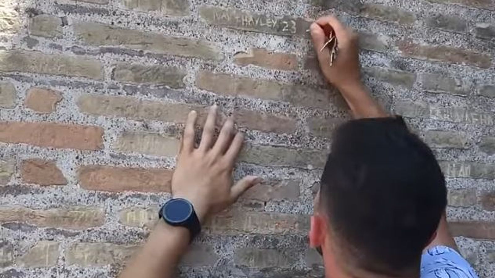 Anger in Italy as tourist filmed carving names into the Colosseum