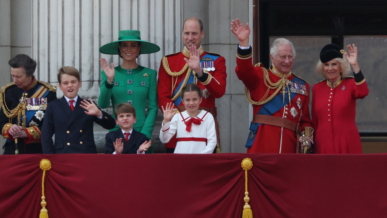Royal Family gather on Buckingham Palace's balcony to watch military