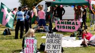 Horse Racing - Epsom Derby Festival - Epsom Downs Racecourse, Epsom, Britain - June 3, 2023 Animal Rising activists display signs to protest before the start of the Epsom Derby Festival Action Images via Reuters/Peter Cziborra