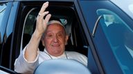 Pope Francis rides in a car on the day of his discharge from Gemelli hospital in Rome, Italy 