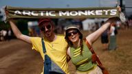 People pose at the Glastonbury Festival site in Somerset, Britain, June 22, 2023. REUTERS/Jason Cairnduff