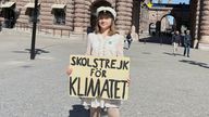 Greta Thunberg stands with a sign that reads, "School Strike for climate", outside the Swedish Parliament on the day of her weekly protest in Stockholm, Sweden, June 9, 2023. REUTERS/Marie Mannes