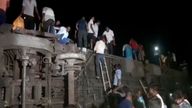 People try to escape from toppled carriages