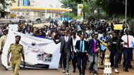 Ugandan students take part in a walk to show their support for the passing of the  LGBTQ+  bill