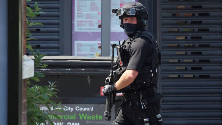 An armed police officer walks on Ilkeston Road following a major incident in Nottingham city centre, Nottingham, Britain, June 13, 2023. REUTERS/Phil Noble
