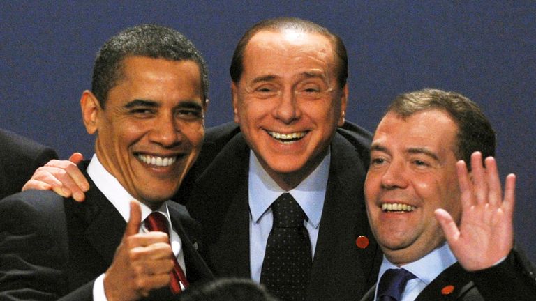 FILE PHOTO: US President Barack Obama laughs with Italian Prime Minister Silvio Berlusconi and Russian President Dmitry Medvedev as they pose for a family photo at the G20 summit at the ExCel Center in east London , Britain, April 2, 2009. REUTERS/Stringer/ File photo
