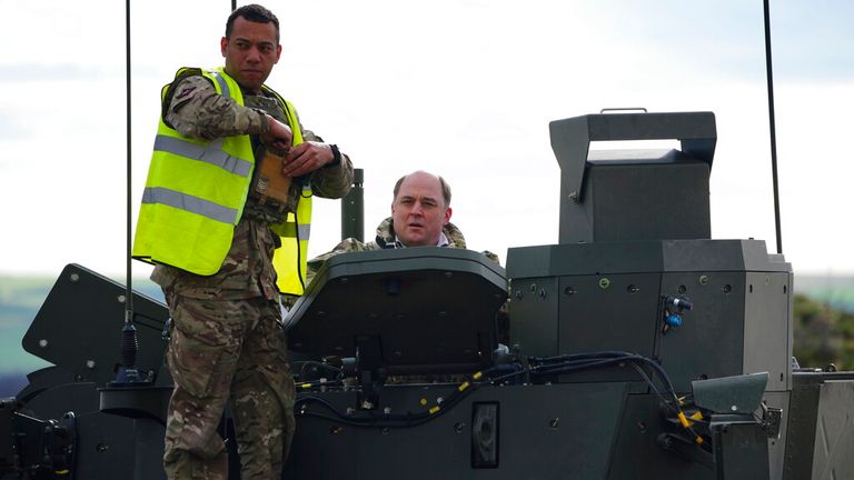 Defence Secretary Ben Wallace climbs out of an Ajax armoured personnel carrier at Bovington Camp military base in Dorset, in February this year Pic: AP 