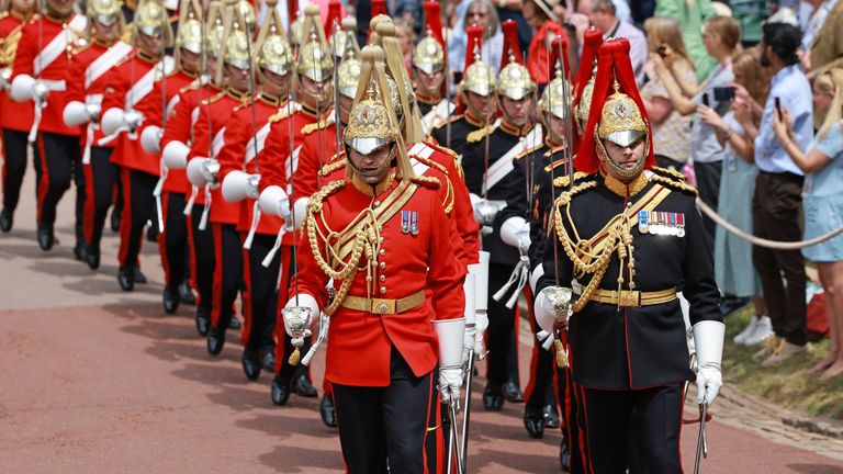 The Life Guards (left) and the Blues and Royals (right) regiments of the Household Cavalry, parade towards St George&#39;s Chapel to attend the annual Order of the Garter Service at, Windsor Castle, Berkshire. Picture date: Monday June 19, 2023.