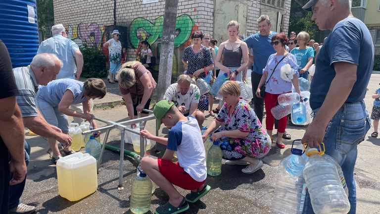  Villagers queue every day to collect water for their homes